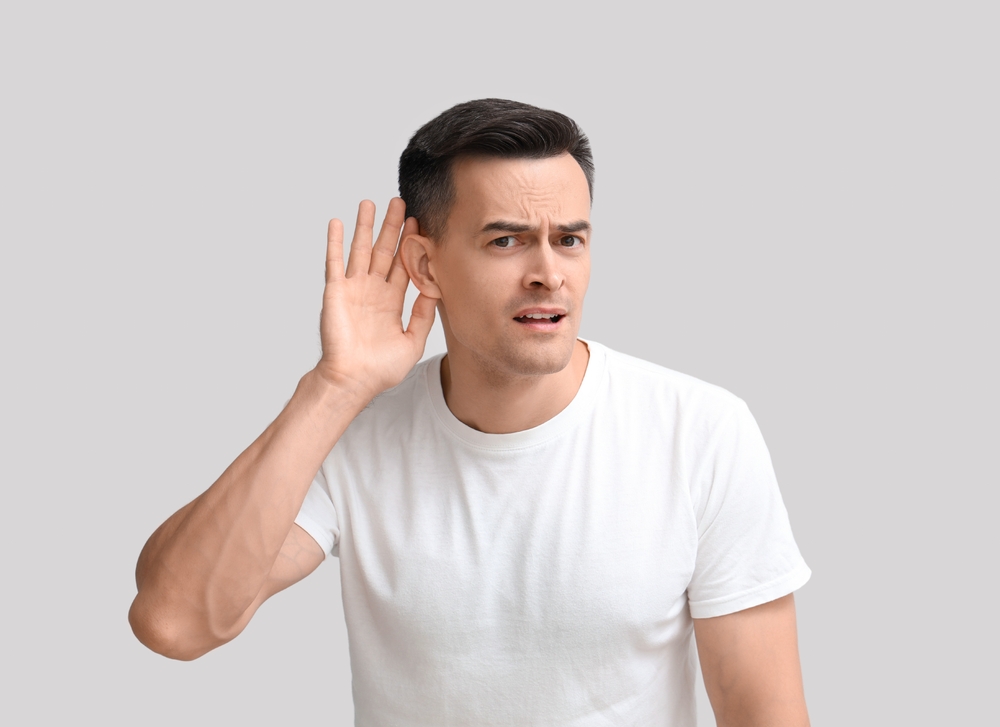 Man struggling to hear.